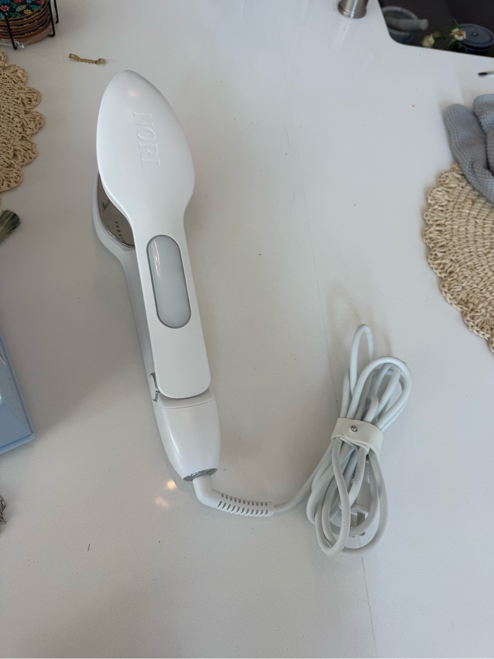 NORI iron. Like new, only used a few times! Comes with box and steam solution.